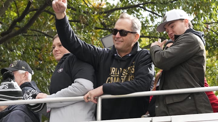 Nov 5, 2021; Atlanta, GA, USA; Atlanta Braves president Derek Schiller waves to the crowd in downtown Atlanta during the World Series championship parade. Mandatory Credit: Dale Zanine-Imagn Images