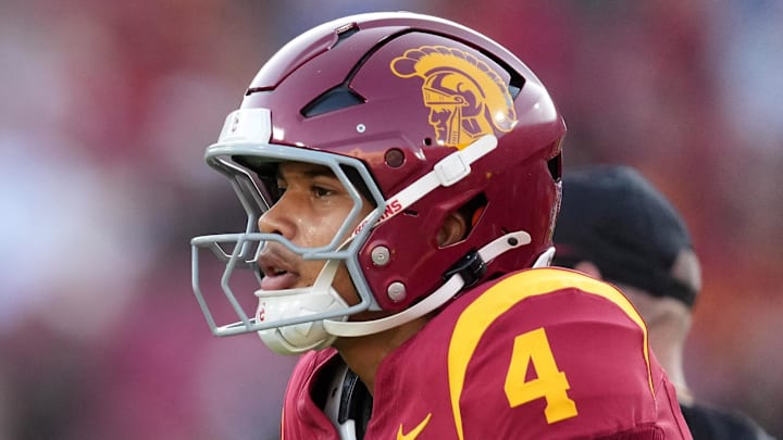 Aug 30, 2025; Los Angeles, California, USA; Southern California Trojans head coach Lincoln Riley talks with Southern California Trojans quarterback Husan Longstreet (4) in the second half against the Missouri State Bears at United Airlines Field at Los Angeles Memorial Coliseum. Mandatory Credit: Kirby Lee-Imagn Images