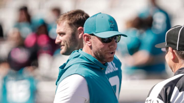 Oct 12, 2025; Jacksonville, Florida, USA;Jacksonville Jaguars head coach Liam Coen talks with a referee before the game against the Seattle Seahawks at EverBank Stadium. Mandatory Credit: Travis Register-Imagn Images