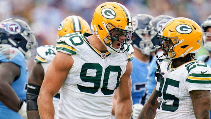 Green Bay Packers defensive end Lukas Van Ness (90) celebrates sacking Tennessee Titans quarterback Will Levis with cornerback Keisean Nixon (25) during the second quarter at Nissan Stadium in Nashville, Tenn., Sunday, Sept. 22, 2024.