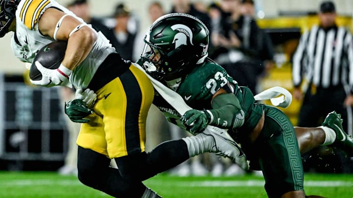Michigan State's Darius Snow, right, tackles Iowa's Kaden Wetjen in the first quarter on Saturday, Oct. 19, 2024, at Spartan Stadium in East Lansing.