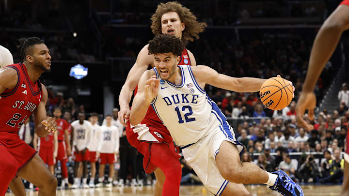 Mar 27, 2026; Washington, DC, USA; Duke Blue Devils forward Cameron Boozer (12) dribbles the ball past St. John's Red Storm forward Ruben Prey (17) in the second half during a Sweet Sixteen game of the East Regional of the men's 2026 NCAA Tournament at Capital One Arena. Mandatory Credit: Geoff Burke-Imagn Images Mar 27, 2026; Washington, DC, USA; Duke Blue Devils forward Cameron Boozer (12) dribbles the ball past St. John's Red Storm forward Ruben Prey (17) in the second half during a Sweet Sixteen game of the East Regional of the men's 2026 NCAA Tournament at Capital One Arena. Mandatory Credit: Geoff Burke-Imagn Images