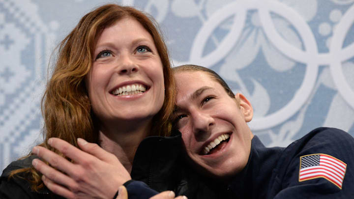 Jason Brown and coach Kori Ade celebrate in the kiss and cry zone during the Sochi Winter Olympics