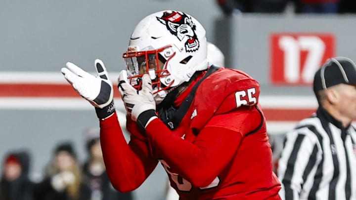 Nov 29, 2025; Raleigh, North Carolina, USA; NC State Wolfpack offensive lineman Jacarrius Peak (65) celebrates at the end zone during the second half of the game against North Carolina Tar Heels at Carter-Finley Stadium. Mandatory Credit: Jaylynn Nash-Imagn Images Nov 29, 2025; Raleigh, North Carolina, USA; NC State Wolfpack offensive lineman Jacarrius Peak (65) celebrates at the end zone during the second half of the game against North Carolina Tar Heels at Carter-Finley Stadium. Mandatory Credit: Jaylynn Nash-Imagn Images