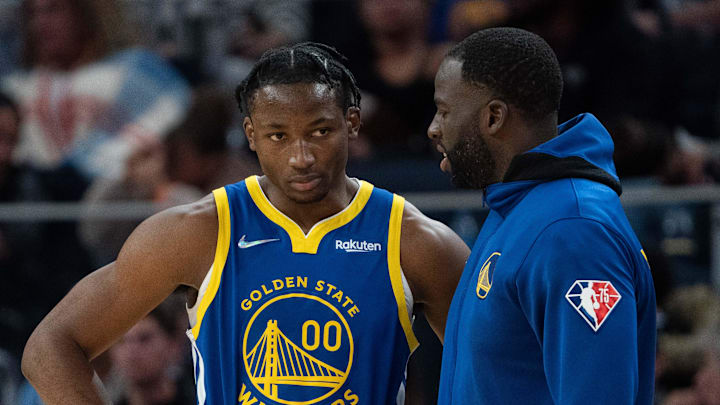 October 30, 2021; San Francisco, California, USA; Golden State Warriors forward Jonathan Kuminga (00) listens to forward Draymond Green (23) during the fourth quarter against the Oklahoma City Thunder at Chase Center. Mandatory Credit: Kyle Terada-Imagn Images