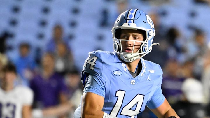 Sep 1, 2025; Chapel Hill, North Carolina, USA; North Carolina Tar Heels quarterback Max Johnson (14) looks to pass in the third quarter at Kenan Stadium. Mandatory Credit: Bob Donnan-Imagn Images Sep 1, 2025; Chapel Hill, North Carolina, USA; North Carolina Tar Heels quarterback Max Johnson (14) looks to pass in the third quarter at Kenan Stadium. Mandatory Credit: Bob Donnan-Imagn Images