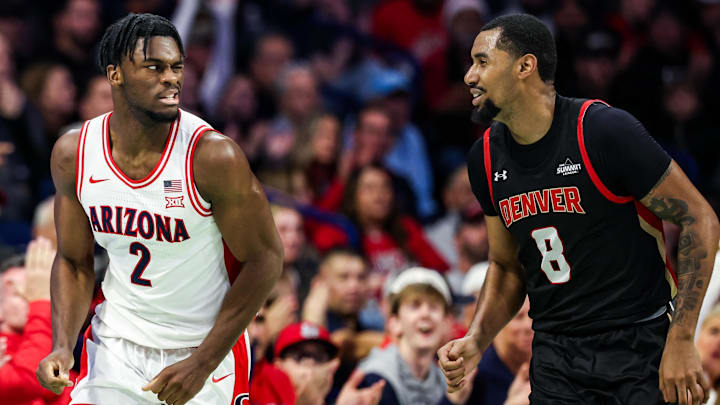 Nov 24, 2025; Tucson, Arizona, USA; Arizona Wildcats guard Dwayne Aristode (2) winks at Denver Pioneers guard Julius Rollins (8) after he makes a three pointer during the first half of the game at McKale Memorial Center. Mandatory Credit: Aryanna Frank-Imagn Images Nov 24, 2025; Tucson, Arizona, USA; Arizona Wildcats guard Dwayne Aristode (2) winks at Denver Pioneers guard Julius Rollins (8) after he makes a three pointer during the first half of the game at McKale Memorial Center. Mandatory Credit: Aryanna Frank-Imagn Images