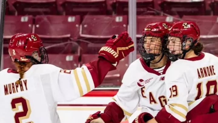 Boston College players celebrate a goal en route to a victory over Holy Cross in home opener.
