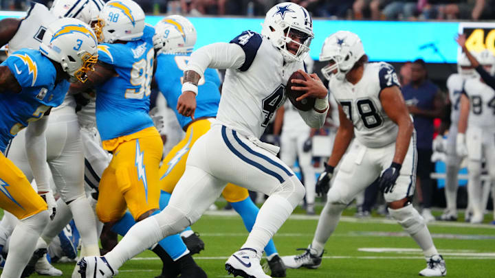 Dallas Cowboys quarterback Dak Prescott scores on an 18-yard touchdown run against the Los Angeles Chargers.