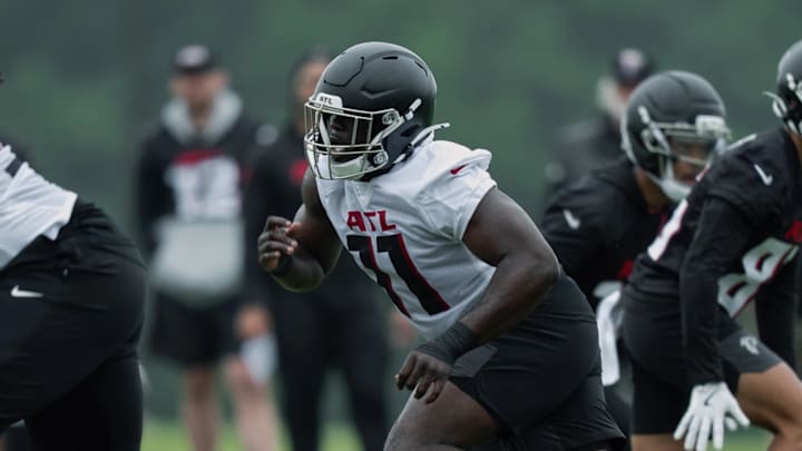 The Atlanta Falcons went all-in this offseason on improving their pass rush, including No. 15 overall draft pick Jalon Walker (11).