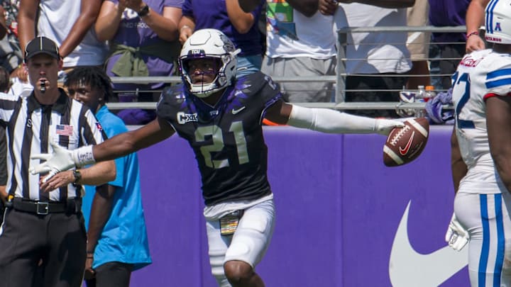 Sep 23, 2023; Fort Worth, Texas, USA; TCU Horned Frogs safety Bud Clark (21) celebrates after he intercepts an SMU Mustangs pass during the second half at Amon G. Carter Stadium. Mandatory Credit: Jerome Miron-Imagn Images