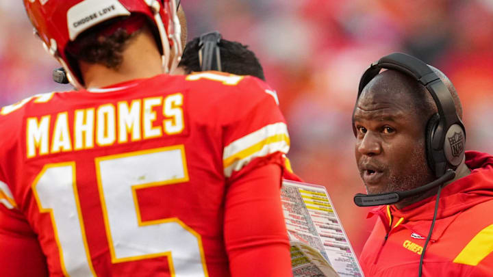 Oct 16, 2022; Kansas City, Missouri, USA; Kansas City Chiefs offensive coordinator Eric Bieniemy talks with quarterback Patrick Mahomes (15) during the second half against the Buffalo Bills at GEHA Field at Arrowhead Stadium. Mandatory Credit: Jay Biggerstaff-Imagn Images