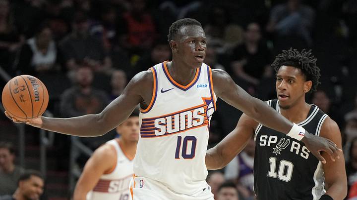 Oct 10, 2026; Phoenix, Arizona, USA;  Phoenix Suns center Khaman Maluach (10) shields the ball from San Antonio Spurs center Tarris Reed Jr. (10) in the second half at Mortgage Matchup Center.  Mandatory Credit: Rick Scuteri-Imagn Images
