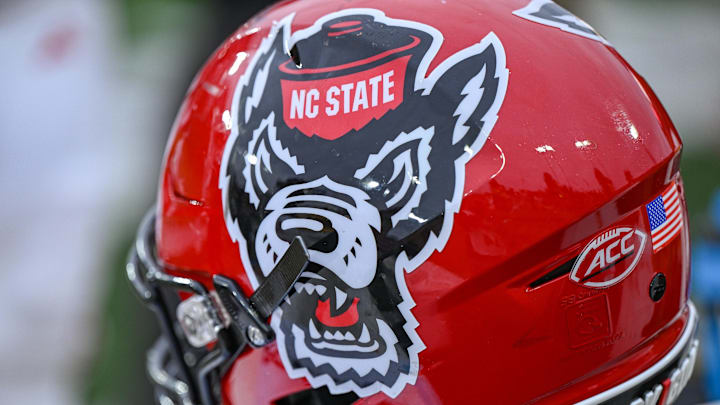 Nov 11, 2023; Winston-Salem, North Carolina, USA; The North Carolina State Wolfpack helmet rests on the bench during the second half against the Wake Forest Demon Deacons at Allegacy Federal Credit Union Stadium. Mandatory Credit: William Howard-Imagn Images