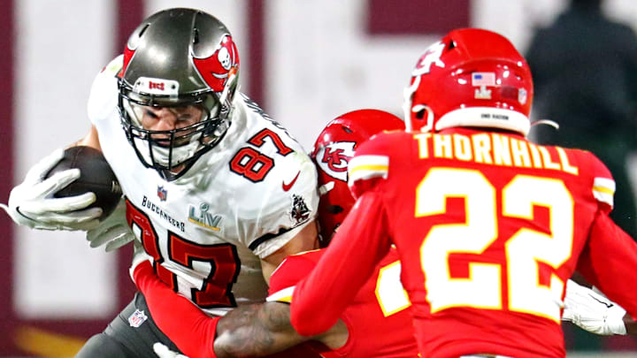 Feb 7, 2021; Tampa, FL, USA;  Tampa Bay Buccaneers tight end Rob Gronkowski (87) runs the ball against Kansas City Chiefs free safety Juan Thornhill (22) during the second quarter in Super Bowl LV at Raymond James Stadium.  Mandatory Credit: Mark J. Rebilas-Imagn Images