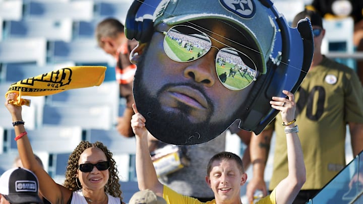 Steelers fans Jasmine Burt-Festa and her husband Brandon Festa show their team support with Jasmine's terrible towel and Brandon's Steelers head coach Mike Tomlin bighead before the start of Saturday's game. The Jacksonville Jaguars hosted the Pittsburgh Steelers in pre-season football at TIAA Bank Field in Jacksonville, FL Saturday, August 20, 2022. [Bob Self/Florida Times-Union]

Jki 082022 Bs Jags Vs Stee