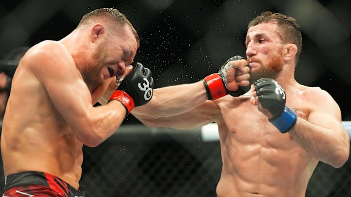 Mar 11, 2023; Las Vegas, Nevada, USA; Petr Yan (red gloves) fights Merab Dvalshvili (blue gloves) during UFC Fight Night at Virgin Hotel. Mandatory Credit: Ron Chenoy-Imagn Images