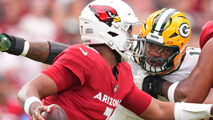 Green Bay Packers defensive end Micah Parsons (1) pursues Arizona Cardinals quarterback Jacoby Brissett. Green Bay Packers defensive end Micah Parsons (1) pursues Arizona Cardinals quarterback Jacoby Brissett.