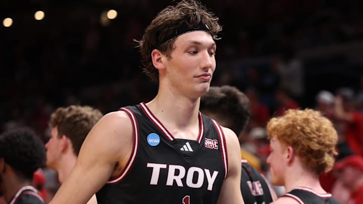 Mar 19, 2026; Oklahoma City, OK, USA; Troy Trojans forward Thomas Dowd (1) walks back to the bench during the second half against the Nebraska Cornhuskers during a first round game of the men's 2026 NCAA Tournament at Paycom Center. Mandatory Credit: William Purnell-Imagn Images