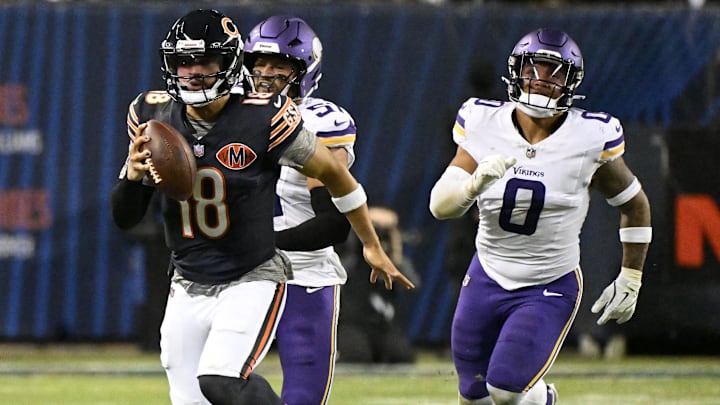 Chicago Bears quarterback Caleb Williams (18) rushes the ball against the Minnesota Vikings during the second half at Soldier Field.