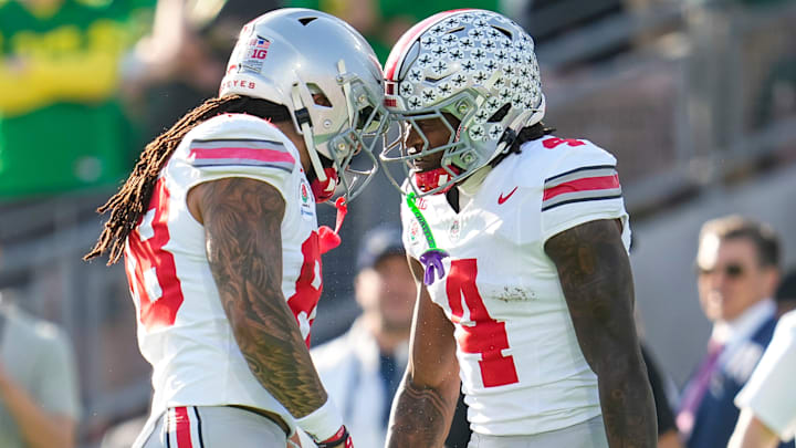 Ohio State Buckeyes wide receiver Jeremiah Smith (4) celebrates a touchdown with otight end Gee Scott Jr. (88) during the first half of the College Football Playoff quarterfinal against the Oregon Ducks at the Rose Bowl in Pasadena, Calif. on Jan. 1, 2025. Ohio State Buckeyes wide receiver Jeremiah Smith (4) celebrates a touchdown with otight end Gee Scott Jr. (88) during the first half of the College Football Playoff quarterfinal against the Oregon Ducks at the Rose Bowl in Pasadena, Calif. on Jan. 1, 2025.