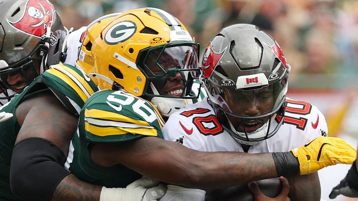 Green Bay Packers linebacker Edgerrin Cooper (56) sacks Tampa Bay Buccaneers quarterback Jalon Daniels. Green Bay Packers linebacker Edgerrin Cooper (56) sacks Tampa Bay Buccaneers quarterback Jalon Daniels.
