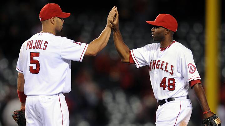 Angels first baseman Albert Pujols (5) celebrates with right fielder Torii Hunter (48) after the game against the Oakland Athletics at the Angel Stadium of Anaheim. The Los Angeles Angels defeated the Oakland Athletics 6-0 on April 16, 2012. Angels first baseman Albert Pujols (5) celebrates with right fielder Torii Hunter (48) after the game against the Oakland Athletics at the Angel Stadium of Anaheim. The Los Angeles Angels defeated the Oakland Athletics 6-0 on April 16, 2012.