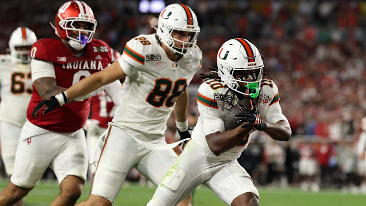 Jan 19, 2026; Miami Gardens, FL, USA; Miami Hurricanes wide receiver Malachi Toney (10) rushes the ball for a touchdown against the Indiana Hoosiers in the second half during the College Football Playoff National Championship game at Hard Rock Stadium. Mandatory Credit: Nathan Ray Seebeck-Imagn Images