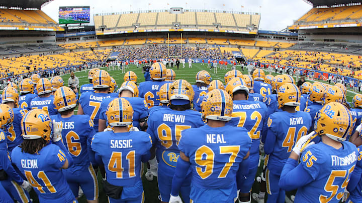 Nov 16, 2024; Pittsburgh, Pennsylvania, USA;  The Pittsburgh Panthers take the field to warm up against the Clemson Tigers at Acrisure Stadium. Mandatory Credit: Charles LeClaire-Imagn Images