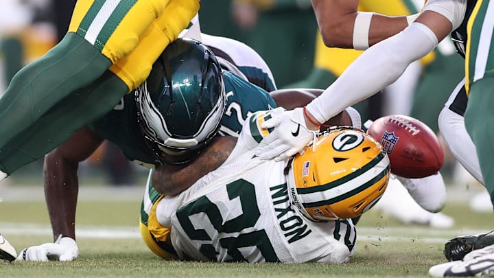 Jan 12, 2025; Philadelphia, Pennsylvania, USA; Philadelphia Eagles linebacker Oren Burks (42) causes a fumble on the opening kick off against the Green Bay Packers during the first quarter in the NFC wild card game at Lincoln Financial Field. Mandatory Credit: Bill Streicher-Imagn Images