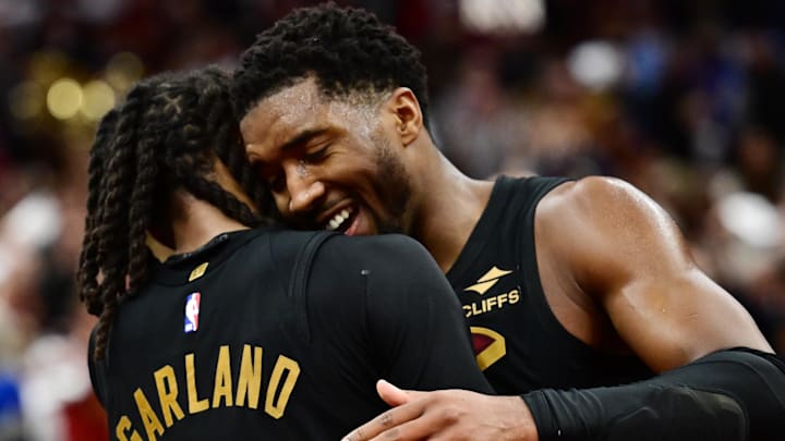 Nov 15, 2024; Cleveland, Ohio, USA; Cleveland Cavaliers guard Darius Garland (10) and guard Donovan Mitchell (45) celebrate after the Cavs beat the Chicago Bulls and moved to 14-0 on the season at Rocket Mortgage FieldHouse. Mandatory Credit: Ken Blaze-Imagn Images
