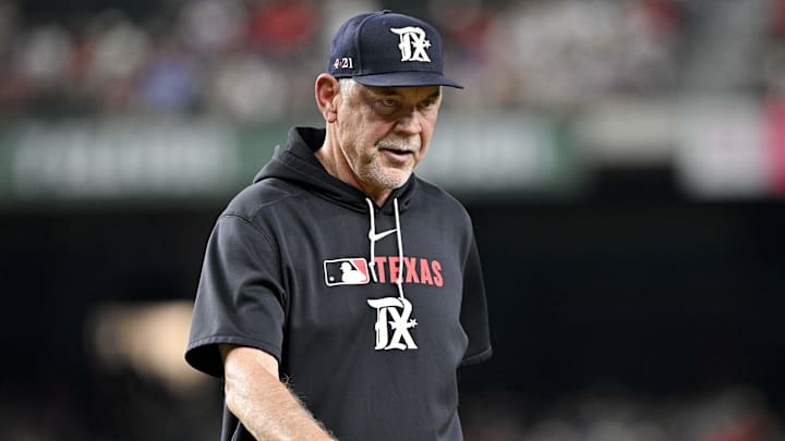 Jul 25, 2025; Arlington, Texas, USA; Texas Rangers manager Bruce Bochy (15) walks back to the dugout during the game against the Atlanta Braves at Globe Life Field. 