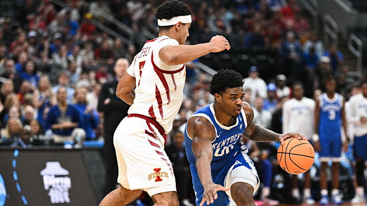 Mar 22, 2026; St. Louis, MO, USA; Kentucky Wildcats guard Otega Oweh (00) drives against Iowa State Cyclones guard Tamin Lipsey (3) during the first half during a second round game of the men's 2026 NCAA Tournament at Enterprise Center.