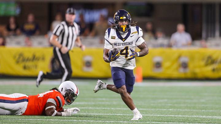Sep 19, 2026; Charlotte, North Carolina, USA; West Virginia Mountaineers running back Cam Cook (4) runs the ball during the first quarter against the Virginia Cavaliers at Bank of America Stadium. Sep 19, 2026; Charlotte, North Carolina, USA; West Virginia Mountaineers running back Cam Cook (4) runs the ball during the first quarter against the Virginia Cavaliers at Bank of America Stadium.