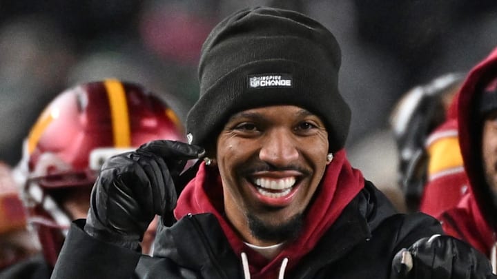 Washington Commanders quarterback Jayden Daniels celebrates touchdown run by quarterback Josh Johnson. Washington Commanders quarterback Jayden Daniels celebrates touchdown run by quarterback Josh Johnson.