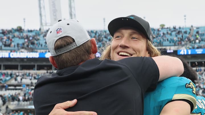 Jan 4, 2026; Jacksonville, Florida, USA; Jacksonville Jaguars quarterback Trevor Lawrence (16) celebrates with head coach Liam Coen (obscured) after the game against the Tennessee Titans at EverBank Stadium. Mandatory Credit: Morgan Tencza-Imagn Images