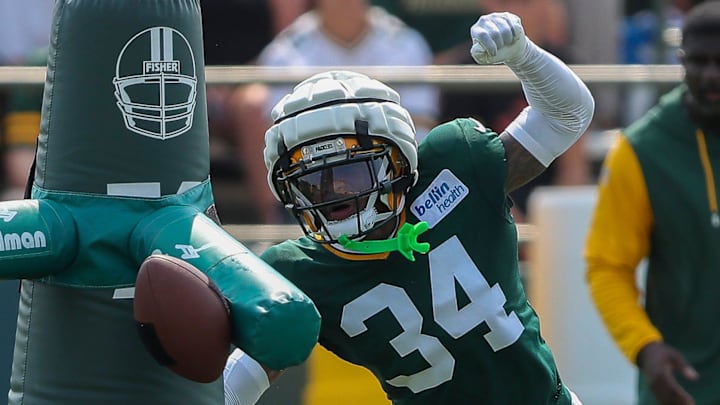 Green Bay Packers cornerback Kalen King (34) runs through a drill during the seventh practice of training camp 