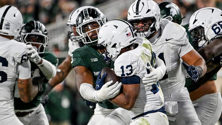 Michigan State's Jalen Thompson tackles Penn State's Kaytron Allen last week in East Lansing.