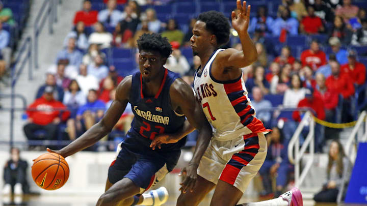South Alabama Jaguars forward Barry Dunning Jr. (22) drives to the basket as Mississippi Rebels guard Davon Barnes (7) defends during the second half at C.M. 'Tad' Smith Coliseum. 