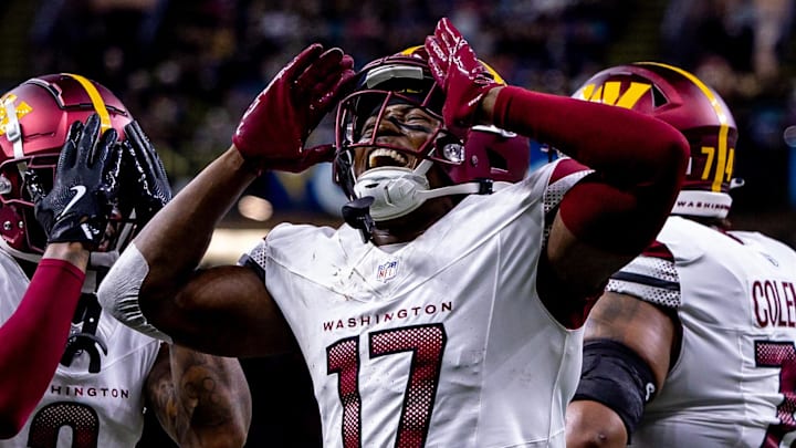 Dec 15, 2024; New Orleans, Louisiana, USA;  Washington Commanders wide receiver Terry McLaurin (17) reacts to scoring a touchdown against the New Orleans Saints during the first half at Caesars Superdome. Mandatory Credit: Stephen Lew-Imagn Images