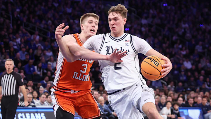 Feb 22, 2025; New York, NY, USA;  Duke Blue Devils guard Cooper Flagg (2) drives past Illinois Fighting Illini forward Ben Humrichous (3) in the first half at Madison Square Garden. 
