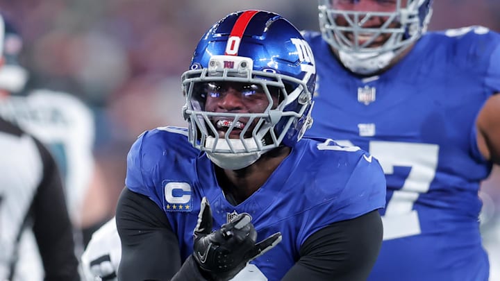 Oct 9, 2025; East Rutherford, New Jersey, USA; New York Giants linebacker Brian Burns (0) celebrates after a sack against the Philadelphia Eagles during the first quarter of the game at MetLife Stadium.  