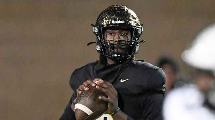 Gaffney's Jayvon Gilmore (8) looks to pass near TL Hanna junior Emari Nance (24) during the first quarter of State Class 5A football playoffs at Gaffney High School in Gaffney, S.C. Friday, November 29, 2024.
