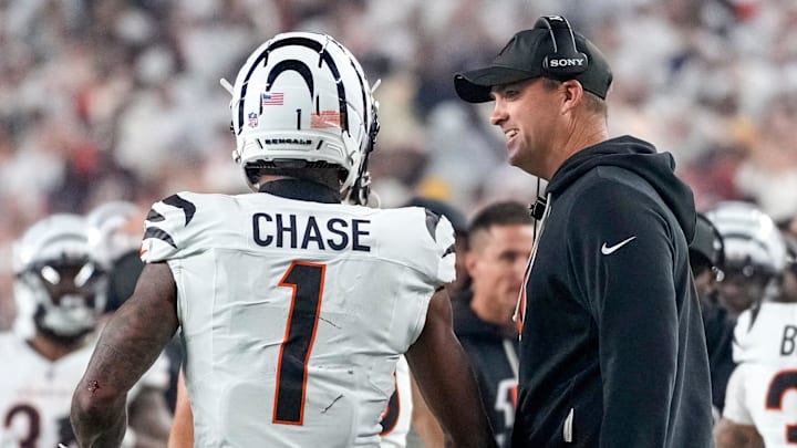 Cincinnati Bengals wide receiver Ja'Marr Chase (1) and head coach Zac Taylor celebrate a touchdown in the second quarter of the NFL Week 7 game between the Cincinnati Bengals and the Pittsburgh Steelers at Paycor Stadium in downtown Cincinnati on Thursday, Oct. 16, 2025.