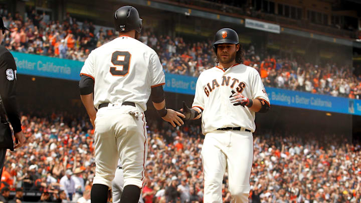 May 20, 2018; San Francisco, CA, USA; San Francisco Giants infielder Brandon Crawford (35) celebrates with infielder Brandon Belt (9) after scoring a run in the sixth inning against the Colorado Rockies at AT&T Park. Mandatory Credit: Kiel Maddox-Imagn Images