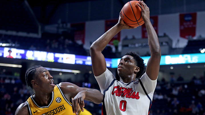 Jan 10, 2026; Oxford, Mississippi, USA; Mississippi Rebels forward Malik Dia (0) drives to the basket as Missouri Tigers guard/forward Mark Mitchell (25) defends during the second half at The Sandy and John Black Pavilion at Ole Miss. Mandatory Credit: Petre Thomas-Imagn Images