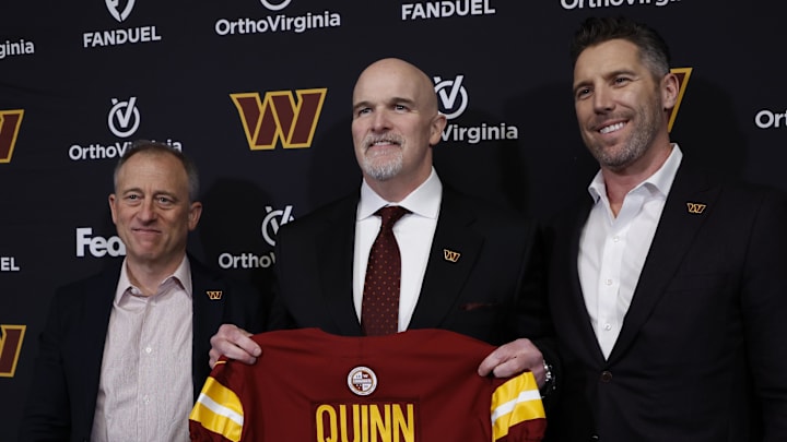 Feb 5, 2024; Ashburn, VA, USA; Washington Commanders head coach Dan Quinn (M) poses for a picture with Commanders managing partner Josh Harris (L) and Washington Commanders general manager Adam Peters (R) at an introductory press conference at Commanders Park. Mandatory Credit: Geoff Burke-Imagn Images
