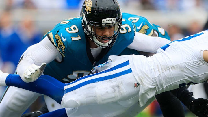 Jacksonville Jaguars defensive end Arik Armstead (91) helps on the tackle against Indianapolis Colts wide receiver Michael Pittman Jr. (11) during the third quarter of an NFL football matchup Sunday, Oct. 6, 2024 at EverBank Stadium in Jacksonville, Fla. The Jaguars edged the Colts on a field goal 37-34. [Corey Perrine/Florida Times-Union]