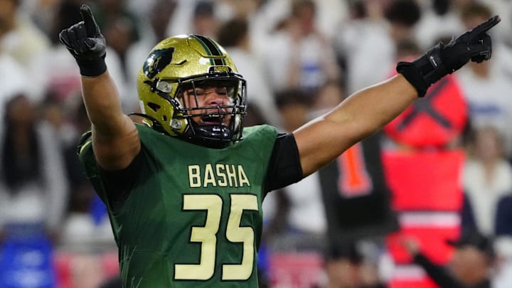 Basha defensive end Caleb Jordan (35) celebrates a sack against Chandler quarterback Will Mencl (7) during the Open state championship at Mountain America Stadium in Tempe on Dec. 6, 2025.