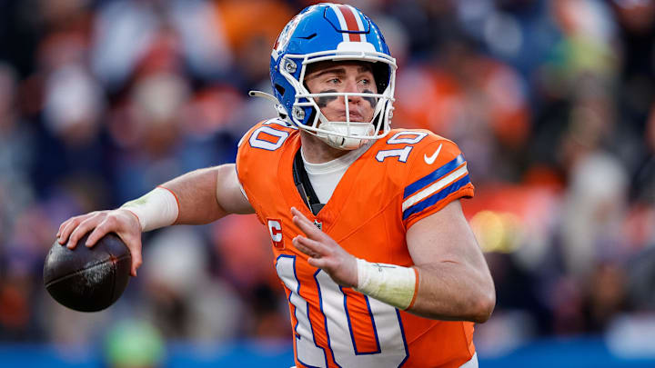 Jan 5, 2025; Denver, Colorado, USA; Denver Broncos quarterback Bo Nix (10) looks to pass in the third quarter against the Kansas City Chiefs at Empower Field at Mile High. 